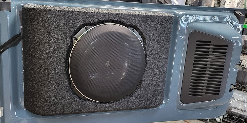 Image Of Newly Installed Speaker In The Door Of The Car